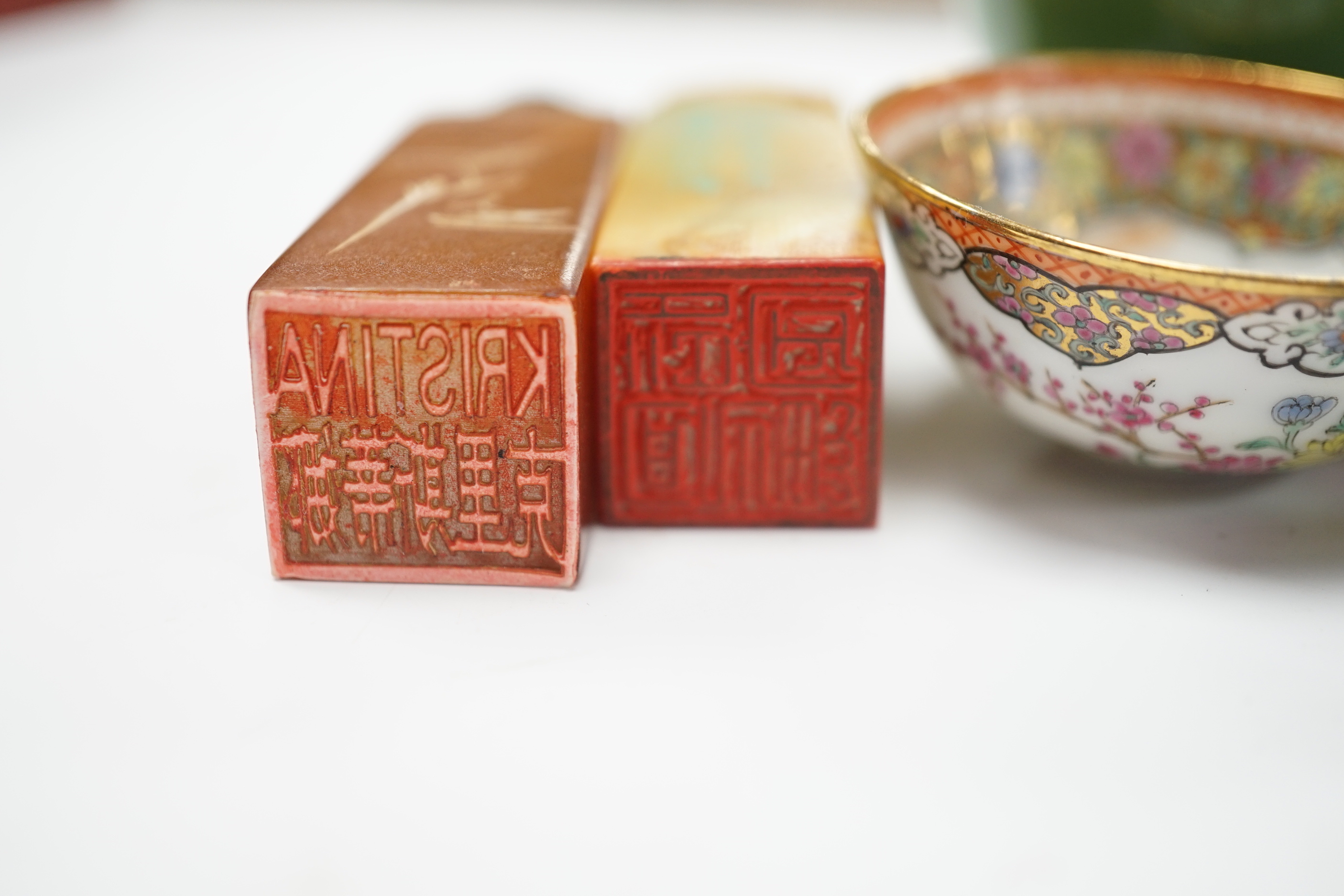 A group of Chinese and Japanese ceramics and works of art including two carved seals and tea bowls housed in a red lacquered box